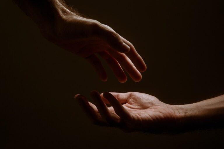 persons hand forming heart